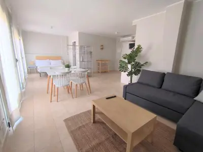 a living room with a couch and a table at Mazi Apartments Havana in Mataró