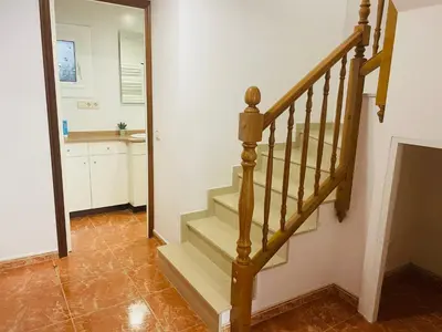 a staircase in a room with a mirror at Beach Apartment Artigas in Badalona