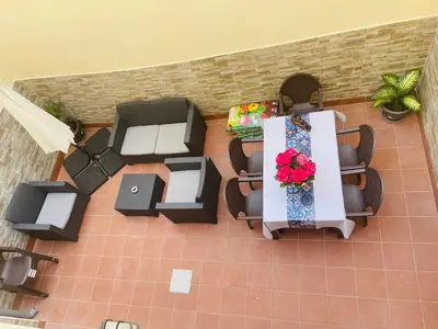 an overhead view of a room with tables and chairs at Beach Apartment Artigas in Badalona