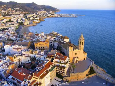 an aerial view of a town next to the ocean at Marina Beach Aiguadolç Sitges in Sitges