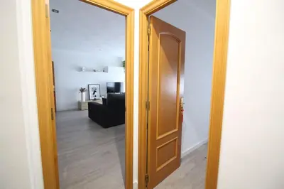 an open door to a room with a living room at Nice new apartment only 30min to Barcelona center. in Granollers