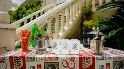 a table with a red and white table cloth on it at La Casa de Mima in Cubelles