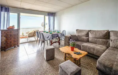 a living room with a couch and a table at Nice Apartment In Pineda De Mar in Pineda de Mar