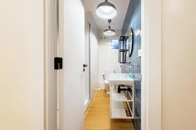 a bathroom with a sink and a mirror at BeBarceloner Eixample Apartments in Barcelona