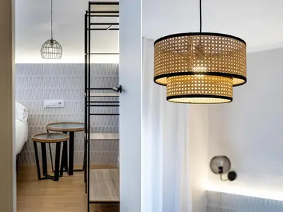 a living room with white walls and a hardwood floor at BeBarceloner Eixample Apartments - 4 bedrooms in Barcelona