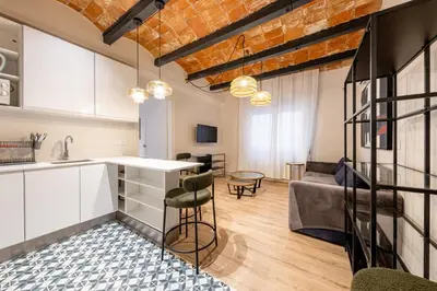 a bathroom with two sinks and a mirror at BeBarceloner Eixample Apartments - 4 bedrooms in Barcelona
