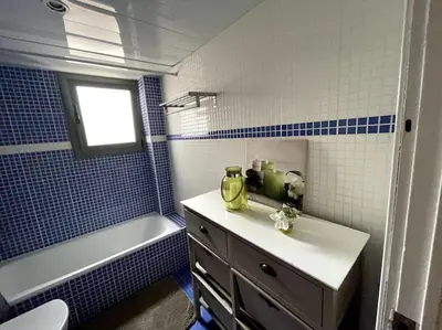 a bathroom with a sink and a toilet and a tub at Pure Bliss Apartment Sitges in Sitges