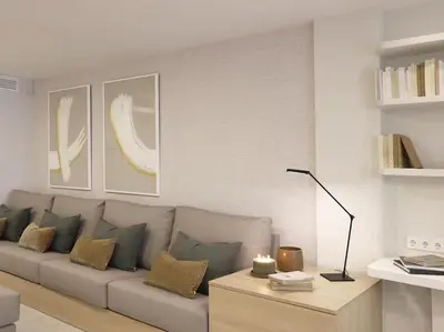 a living room with a couch and a table at Sitges Spaces Bonaire Beach Condo in Sitges