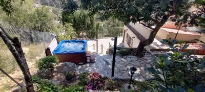 a house with a blue tub in a yard at SILOM HOUSE in Sant Pere de Ribes