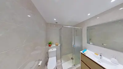 a bathroom with a shower and a toilet and a sink at PREMIUM HABITAT LA RIERA in Pineda de Mar