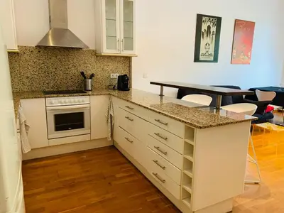 a kitchen with a counter top and a stove top oven at Hermoso piso en el centro de Barcelona in Barcelona