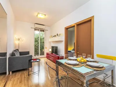 a living room with a table and a couch at Apartment Sants-Montjuïc- Avenida Madrid by Interhome in Barcelona