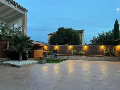 a courtyard of a house with a fence at Cal General in San Vicente de Castellet