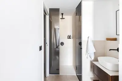 a white bathroom with a sink and a shower at master La Rambla in Barcelona
