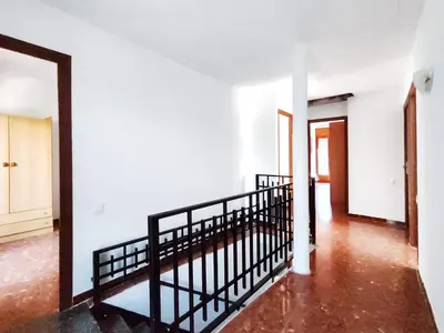an empty hallway with a staircase in a house at Casa con piscina privada en Sant Pol de Mar in San Pol de Mar