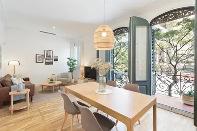 a living room with a table and chairs at Click&Flat Gaudi Dream I in Barcelona