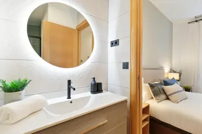 a bathroom with a sink and a mirror at Click&Flat Gaudi Dream I in Barcelona